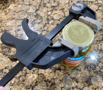 can on counter with clamp around it